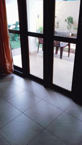 an open door to a patio with a table at Villa DeLorenta in Anuradhapura