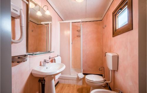 a bathroom with a sink and a toilet and a shower at Cherubini in Montaione