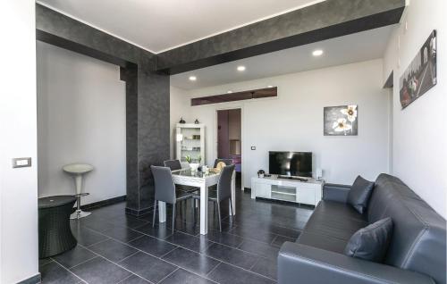 a living room with a couch and a table at Villa Bellavista in Gaggi