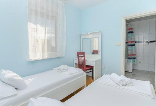 Giường trong phòng chung tại Apartments Villa AS Jezera