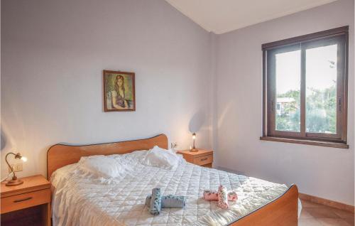 a bedroom with a bed with stuffed animals on it at Matteo Appartamento in Ovile la Marinella