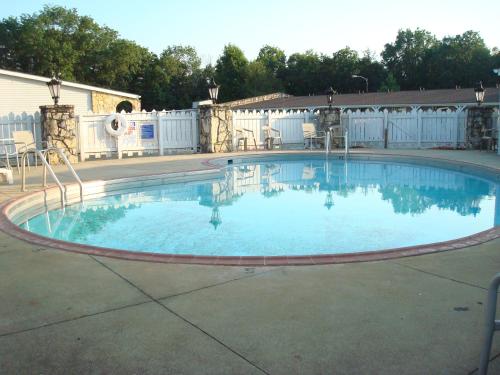 a large swimming pool in a yard at Corbin Inn in Corbin