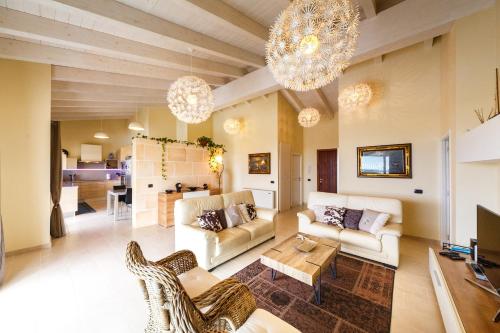 a living room with two couches and a table at Bini Sole - Villa de lujo con piscina en Menorca in Binibeca