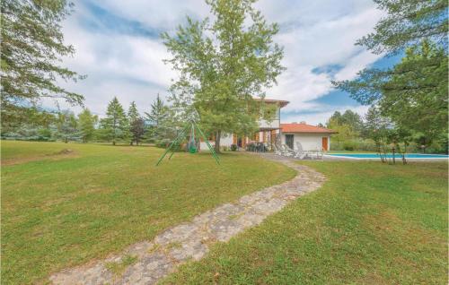 a large yard with a house and a playground at Villa Il Colle in Molezzano