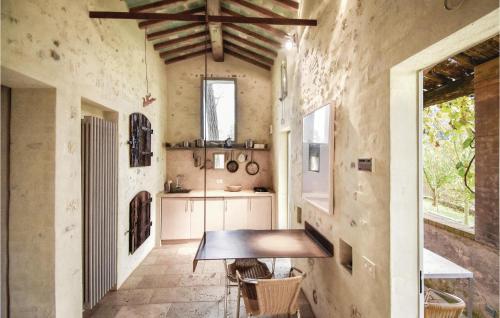 a kitchen with a wooden table in a room at Sanlucchese 4 in Poggibonsi