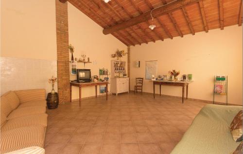 a living room with a couch and a table at Casale Del Borgo 13 in Querce