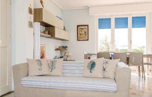 a living room with a couch with pillows on it at Villa Marina in Granelli