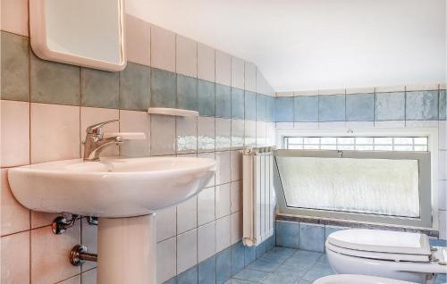 a bathroom with a sink and a toilet at Casa Sardina in Mandra Capreria