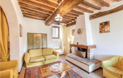 a living room with a couch and a fireplace at Apartment Todi PG 27 in Canonica