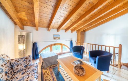 a living room with a couch and a table and chairs at Macchia Blu in Caprino Veronese