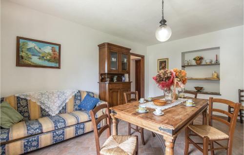 a living room with a table and a couch at Beautiful Home In Acquasparta -Tr- in Configni
