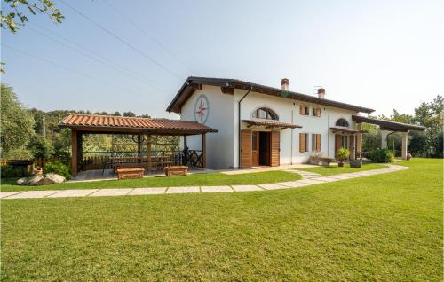 a house with a large yard with a building at Macchia Rossa in Caprino Veronese