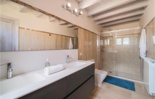 a bathroom with a large sink and a shower at 4 Bedroom Lovely Home In Muro in San Lorenzo