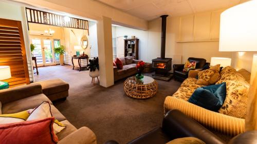 
a living room filled with furniture and a couch at Margaret River Guest House in Margaret River Town
