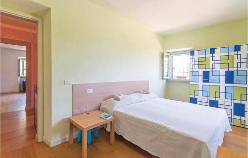 a small bedroom with a bed and a table at Podere Case Sparse in Citerna