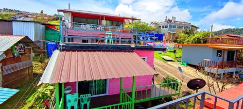 an overhead view of a colorful house with a balcony at ไร่รุ่งอรุณ ภูทับเบิก in Ban Maeo Thap Boek