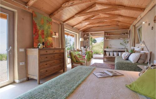 a large room with a bed and a dresser at Chalet Calvenere in Calvene