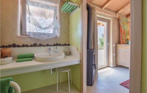 a bathroom with a sink and a window at Chalet Calvenere in Calvene