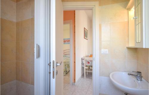 a bathroom with a sink and a toilet and a shower at Villa Marina B in Rosolina