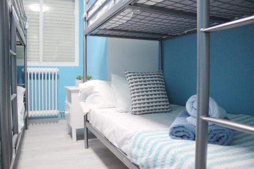 A bed or beds in a room at El PISO MAS CÉNTRICO DEL HUMEDO DESAYUNO INCLUIDO