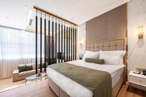 a bedroom with a large bed and a large window at Veyron Hotels & SPA in Istanbul