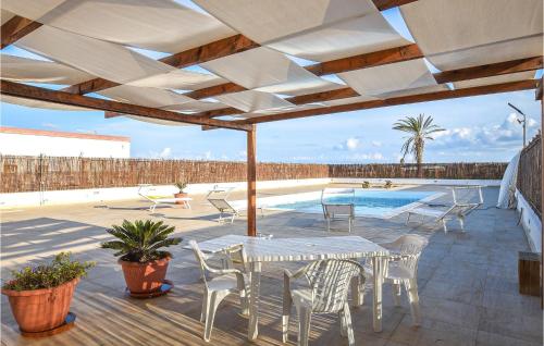 Beautiful home in Portopalo di C,P, with 4 Bedrooms, WiFi and Outdoor swimming pool