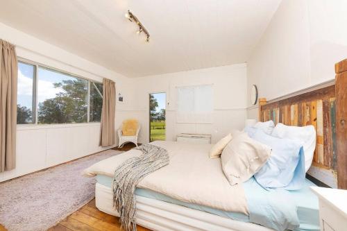 Voodi või voodid majutusasutuse Katandra Homestead: old world charm on Wallis Lake toas
