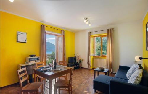 a living room with a table and a couch at Appartamento Romano in Verbania