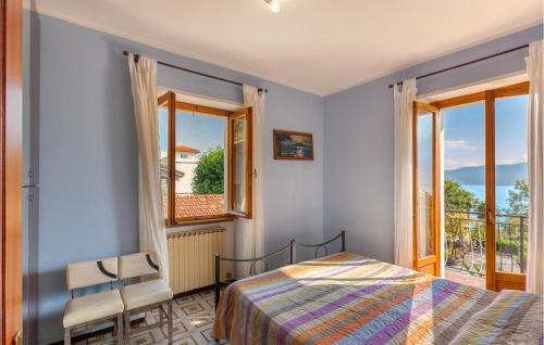 a bedroom with a bed and a window at Appartamento Romano in Verbania