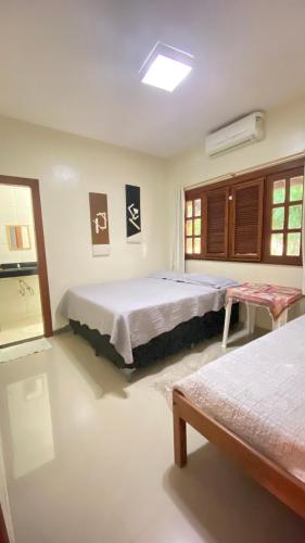 a bedroom with two beds in a room at CasaMares Macapá - Praia de Macapá in Macapá