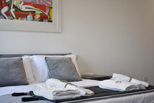 a bed with towels sitting on top of it at Tenuta Micoli in Frisa