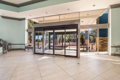 an empty house with glass doors and a patio at Clarion Inn & Suites Florence - Darlington in Florence
