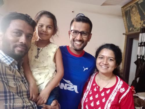 a group of three people posing for a picture at Krishna Homestay Hampi in Hampi