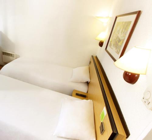 Postel nebo postele na pokoji v ubytování Campanile Hotel & Restaurant Gouda
