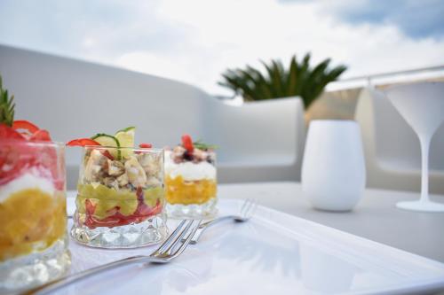 three desserts in glass vases on a table at Tenuta Micoli in Frisa