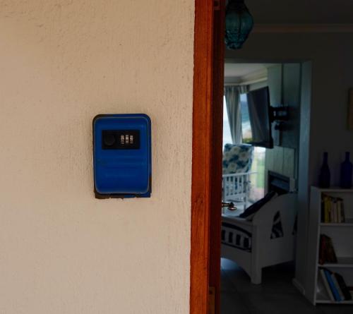 a blue box on the side of a wall at Whales & Waves in Hermanus