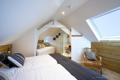 Giường trong phòng chung tại Chambres d'Hôtes - La terrasse Bayehon - Ovifat