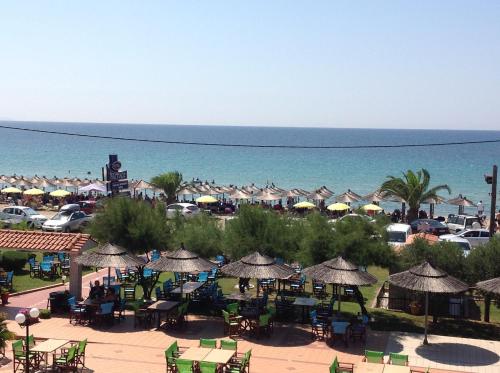 a view of a beach with umbrellas and the ocean at Hotel Nautilos in Sozopoli