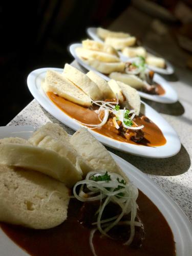 a group of plates of food on a table at Hotel a Penzion PEGAS in Nové Město na Moravě
