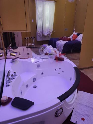 a bathroom with a bath tub in a room at HOTEL VILLA ISA in Pescara