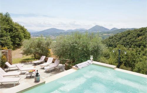 a swimming pool with a view of mountains at Podere Giovannini in Niccone
