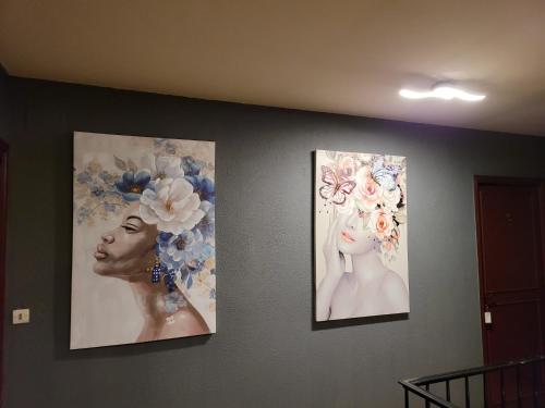 three pictures of a woman on a wall at Le Chalet Montégut in Moulins