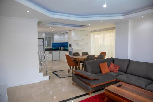 A seating area at Sunrise hill villa with private pool