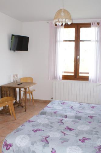 Postel nebo postele na pokoji v ubytování Au Pichet