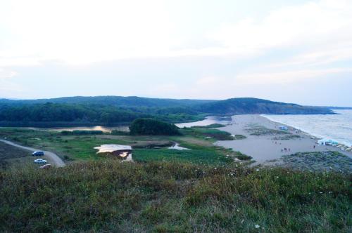 a view of a beach with people in the water at Guest House Dara in Tsarevo