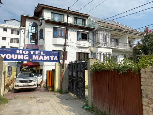 a hotel young marina sign in front of a building at Hotel Young Mamta in Srinagar