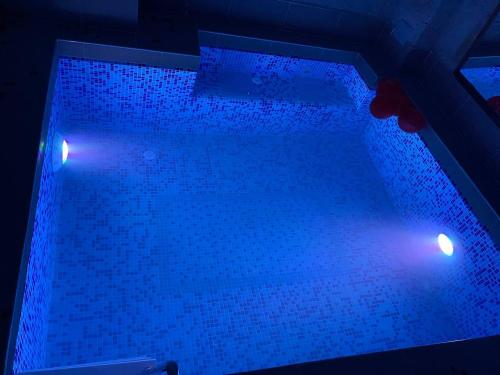 a pool with blue lights on top of it at Zuwinasa House Hotel in Avanos
