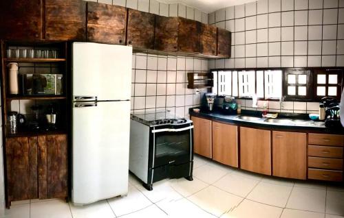 A kitchen or kitchenette at Hostel flor do Caribe