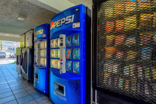 a couple of blue gas pumps in a store at Motel 6-Rowland Heights, CA - Los Angeles - Pomona in Rowland Heights