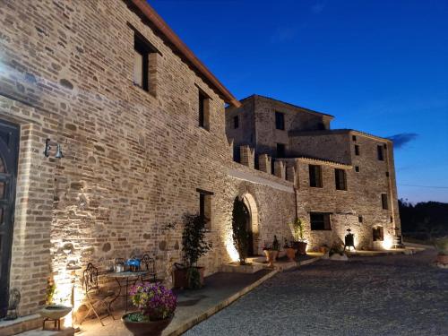a large stone building with aventhventhventhventhventhventhventhventhventhventh at Castello di Petecciano B&B in Mosciano SantʼAngelo